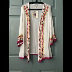 This Pretty Light Weight Cardigan Can Be Worn With A Favorite Blouse, Or With Your Bathing Suit. Material Is 100% Rayon. Casual Long Sleeve Cardigan With Floral Embroidery, Spring Floral Embroidered Long Sleeve Cardigan, Long Sleeve Floral Embroidered Cardigan For Spring, Long Sleeve Cotton Cardigan With Floral Embroidery, Pink Embroidered Long Sleeve Cardigan, Spring Multicolor Embroidered Long Sleeve Cardigan, White Embroidered V-neck Cardigan, Summer Cotton Cardigan With Floral Embroidery, Summer Open Front Cardigan With Floral Embroidery