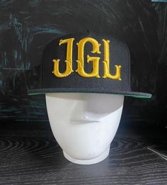 This snapback is a great gift for yourself or someone else, it is embroidered and very good quality! If you have any questions feel free to contact me! Black Fitted Hat With Letter Print And Flat Brim, Customizable Black Custom Snapback Hat, Customizable Black Snapback Hat, Custom Black Snapback Hat With Flat Bill, Customizable Black Snapback Hat With Flat Brim, Customizable Black Baseball Cap, Customizable Black Trucker Hat With Flat Brim, Black Snapback Hat With Custom Logo, Black Flat Brim Baseball Cap With Custom Logo