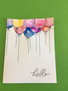 a card with balloons that say pello on it and the word pello written in black ink