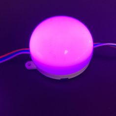 a purple light sitting on top of a table