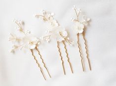 "Elevate your bridal style with these beautiful white floral hair pins featuring a stunning mother of pearl flower. Perfect for romantic half-up hairstyles or bridal updos, these wedding hair clips are a must-have accessory for your special day. Each hair pin is intentionally different to create a natural and whimsical look, adding a touch of effortless charm to your bridal style. These versatile hair accessories can be arranged in a row for a more streamlined look or scattered throughout your r Up Hairdos, Boho Bridal Hair, Floral Wedding Hair, Floral Hair Pins, Bridal Hair Jewelry, Bridal Hair Clip, Wedding Hair Clips, Bridal Updo, Half Up Hair