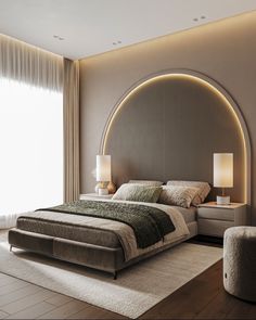 a large bed sitting in the middle of a bedroom next to a tall wall mounted lamp