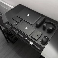 an image of a desk with headphones and laptops on it that says black is heaven