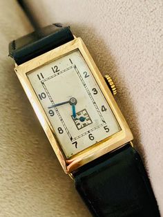 This antique wristwatch is a stunning piece of jewellery that will add a touch of vintage glamour to any outfit. Crafted from 9k solid gold, this watch has a classic Art Deco design that is both elegant and timeless.  Hallmarked 375 Dated 1937 31 x 20mm case 16 jewel swiss movement  With a solid caseback and suitable for both men and women, this wristwatch is perfect for those who appreciate a timeless piece of jewellery. Whether you are looking for a statement accessory or a unique gift for a l Art Deco Watch, Glamour Vintage, Antique Watches, Gold Art Deco, Gold Art, Vintage Glamour, Art Deco Design, Wrist Watches, Classic Art