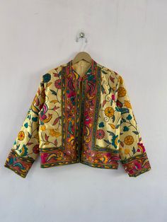 Indian Ethnic Jacket Phulkari Embroidered Vintage stylish designer jacket for women  This is made of cotton fabric with some unique stylish embroidery and printed. A unique combination of colorful embroidery in floral style and bird shape. This jacket is perfect for every traditional functions or parties this gives you a very attractive look. Shop this beautiful outfit for mother's day gift Size : M (40INCH CHEST)  available M, L, XL and we make new jackets according to your measurements in avai Traditional Nehru Jacket With Embroidered Border For Spring, Traditional Nehru Jacket With Multicolor Embroidery For Spring, Traditional Embroidered Nehru Jacket For Spring, Multicolor Floral Embroidery Nehru Jacket For Spring, Spring Multicolor Embroidered Outerwear, Traditional Nehru Jacket With Floral Print, Long Sleeve Cotton Nehru Jacket For Spring, Cotton Outerwear With Multicolor Embroidery Long Sleeve, Traditional Long Sleeve Outerwear With Printed Motifs