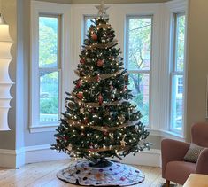 a decorated christmas tree in a living room