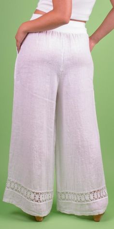 Linen Wide-Leg Pant with Front Pockets and Floral Lace Detail on Bottom Hem. Features a Stretchy Waistband for a Custom Fit. 100% Linen Model is 5'7 One Size Made in Italy White Linen Full-length Bottoms, Spring Capri Pants With Loosely Fitted Hips, Solid Color Relaxed Fit Capri Pants, Solid Capri Length Pants With Relaxed Fit, Relaxed Fit Solid Color Capri Pants, Stretch Linen Full-length Bottoms, Stretch Linen Wide Leg Bottoms, White Stretch Wide Leg Capris, Blouse Casual Fashion