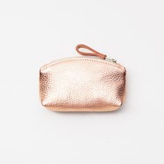 "This cute mini clutch is a perfect little gift for you, your bridesmaids or any special someone. It's individually handcrafted with your choice of FIVE super supple metallic cowhide leathers (rose gold, platinum, silver, gold, or dark bronze). Each pouch has a unlined leather interior with durable top zipper closure. * Do you need more clutches than what is listed? Just send me a message. I can create multiples of this clutch. D E T A I L S : * 100% cowhide leather. * Dimensions: Width 6\" (at Handbag Organizer, Leather Makeup Bag, Metallic Rose Gold, Handbag Organization, Etsy Bridesmaid Gifts, Small Handbag, Makeup Pouch, Carry All Bag, Cosmetic Pouch