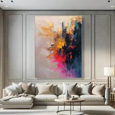 a living room with a large painting on the wall