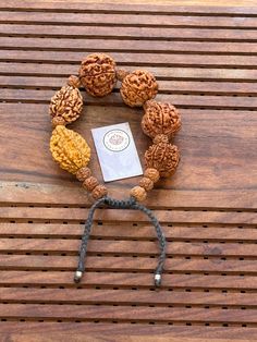 This is a divine bracelet made from natural auspicious beads of 2 - 7 mukhi Rudraksha in black adjustable chord.  This bracelet is adjustable so can fit any wrist size.  This is a healing Shiva bracelet, blessed by priest. The benefits of  2 Mukhi Rudraksha signifies the unity of SHIVA and SHAKTI    We wish you happy wearing and chanting Spiritual Festival Bracelet With 108 Beads, Spiritual Festival Bracelets With 108 Beads, Spiritual Hand-strung Beaded Bracelets For Rituals, Spiritual Beaded Bracelets For Festivals, Handmade Spiritual Friendship Bracelets For Festivals, Traditional Bracelets With 8mm Beads For Festivals, Adjustable Spiritual Mala For Puja, Traditional 8mm Beaded Bracelets For Festivals, Adjustable Bracelets For Meditation And Festivals