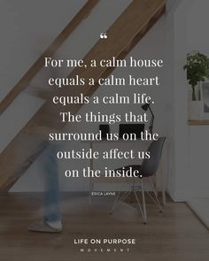 a person standing in front of a staircase with a quote on it that says, for me, a calm house equals a calm heart equals a calm life the things that surround us