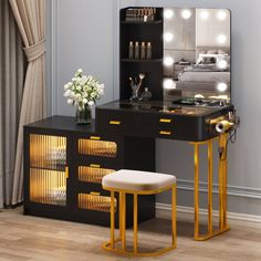 a vanity table with stool and lighted mirror