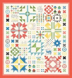 a colorful quilt with many different designs on the front and back, including cross stitchs