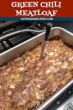 green chili meatloaf in a pan with a spatula being used to stir it