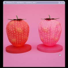 two plastic strawberrys sitting on top of each other in front of a pink background