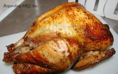 a roasted turkey on a white plate