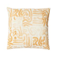 an orange and white pillow on a white background