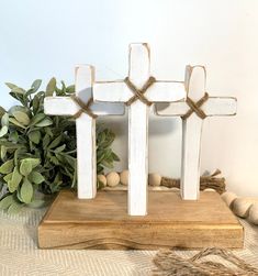 a wooden cross sitting on top of a table