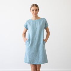 Washed and soft linen dress with short sleeves in various colors made from European flax certified linen. Loungey yet classy, the Alice dress is deceptively simple. The unfussy lines and charming details - like the short sleeves, same-colour zigzagging in the back seam and two subtle pockets - make this flattering dress feminine as well as wearable. Perfect with casual pumps in summer or chunky knits in winter, this dress will be a favourite that outlasts fashion trends. It is made-to-order item Blue Linen Dresses With Short Sleeves, Blue Short Sleeve Linen Dress, Blue Linen Dress Relaxed Fit Short Sleeve, Blue Linen Dress With Short Sleeves And Relaxed Fit, Blue Linen Dress With Short Sleeves Relaxed Fit, Knee-length Flax Linen Dress, Casual Flax Short Sleeve Dress, Spring Linen Dress In Flax Color With Short Sleeves, Blue Linen Short Sleeve Dress For Daywear