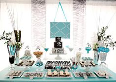 the dessert table is decorated with zebra print