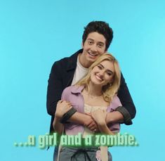 a man standing next to a woman in front of a blue background with the words, a girl and a zombie