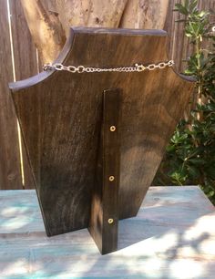 a piece of wood with chains attached to it