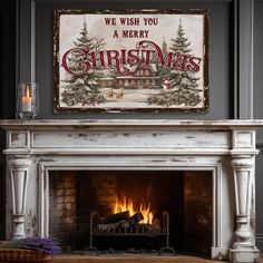 a fireplace with a christmas sign above it