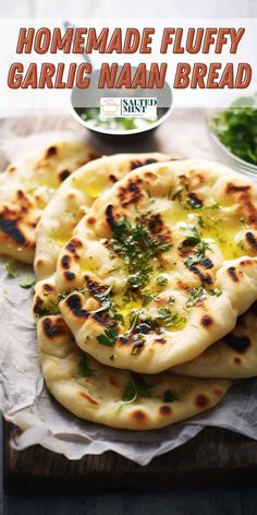 homemade fluffy garlic naan bread on a cutting board