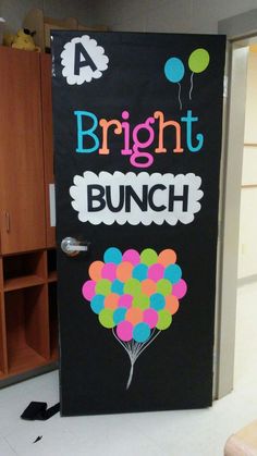 a door decorated with balloons and the words bright bunch