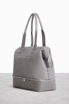 The Mini Weekender in Beige | Beis Travel – Béis Versatile Weekender Bag With Zipper Pocket, Functional Weekend Travel Bag With Luggage Sleeve, Versatile Gym Bag With Luggage Sleeve For Weekend Trips, Versatile Rectangular Gym Bag For Overnight Trips, Versatile Gym Bag For Overnight Trips, Versatile Travel Bag For Overnight Trips, Sporty Tote Weekender Bag, Sporty Tote Weekender Bag For Weekend Trips, Functional Weekend Gym Bag With Luggage Sleeve