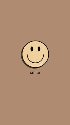 a smiley face with the word smile on it's side, in front of a brown background