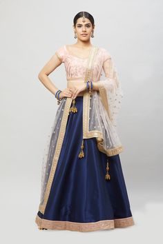 Customize your bridesmaids outfits today! This beautiful blush embroidered blouse contrasted with a navy blue A-line lehenga comes with a complementing blush dupatta! Fabric: Raw silk blouse and skirt, Net dupatta All custom orders will be handled by a Nazranaa Bridal Consultant who will virtually discuss measurements and minor changes according to the client's specifications Occasion: Wedding Ceremony Production time: 3.5-4.5 months Minimum order of 4 pieces WASH CARE INSTRUCTIONS - Please Dry Bridesmaid Bollywood Dupatta, Bridesmaid Choli With Zari Work, Traditional Bridesmaid Lehenga With Pallu, Anarkali Choli For Bridesmaid Festive Occasions, Bollywood Style Bridesmaid Choli For Festive Occasions, Festive Anarkali Choli For Bridesmaids, Bollywood Style Lehenga Saree For Bridesmaid, Traditional Dupatta For Bridesmaid Festive Occasions, Festive Anarkali Bridesmaid Choli