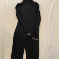 Black Lucky Label Catsuit, Brand New / Never Worn Black Stretch Jumpsuits And Rompers For Loungewear, Black Stretch Unitard For Loungewear, Black Long Sleeve Bodysuit For Loungewear, Casual Black Unitard For Loungewear, Black Catsuit, Black Jumpsuit, Catsuit, Pant Jumpsuit, Jumpsuit Romper