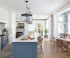 a kitchen with blue cabinets and an island