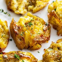 cooked potatoes with herbs and seasoning on a white plate