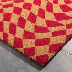 a red and yellow area rug on the floor