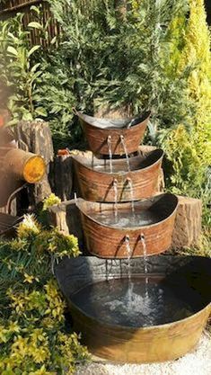 an outdoor fountain with water flowing from it