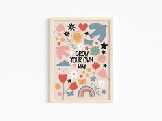 an art print with the words grow your own way in front of flowers and rainbows