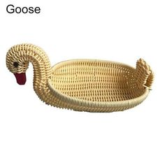 a bird shaped wicker basket with handles