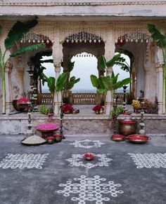 an outdoor area with potted plants and decorations