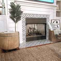 a living room with a fire place and rugs