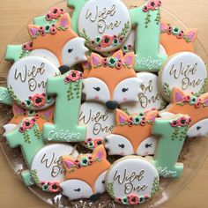 some decorated cookies are sitting on a plate