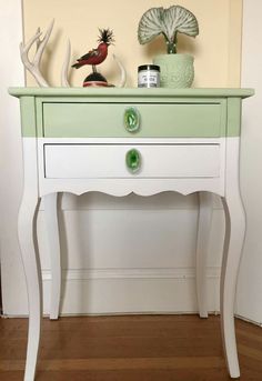 a green and white table with some decorations on top