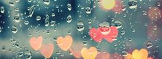 rain drops on the window with hearts hanging from it