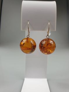 Round Big Brown Amber earrings. Sterling silver 925. Big, hanging, stunning. Length about - 4 cm diameter 2 cm Lever back lock. Stones has natural imperfections due to amber is being natural. https://www.etsy.com/shop/AmberLithuania?ref=simple-shop-header-name&listing_id=780205095&section_id=27948198 Formal Sterling Silver Round Pendant Earrings, Amber Oval Jewelry With Matching Earrings, Yellow Gold Earrings Gift, Yellow Gold Rounded Earrings For Gift, Round Earrings With Polished Finish For Gift, Yellow Round Sterling Silver Earrings, Yellow Round Earrings For Formal Occasions, Classic Yellow Round Earrings, Formal Yellow Round Earrings