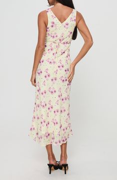 A dreamy floral print covers this slinky dress cut in a sleeveless silhouette and cinched at the waist by a back tie accent. 51" length Hidden side-zip closure V-neck Sleeveless Attached waist tie Lined 100% polyester Machine wash, tumble dry Imported Sleeveless Fitted Floral Dress With Tie Back, Sleeveless Ruched Back Maxi Dress For Brunch, Sleeveless Maxi Dress With Ruched Back For Brunch, Fitted Sleeveless Floral Dress With Tie Back, Flowy Spaghetti Strap Sleeveless Dress With Floral Print, Flowy Sleeveless Dress With Spaghetti Straps And Floral Print, Sleeveless Rayon Dress With Tie Back, Spring Sleeveless Maxi Dress With Ruched Back, Fitted Sleeveless Floral Dress With Smocked Back