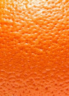 an orange is shown close up on the surface