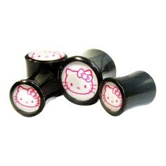 three black rollers with hello kitty designs on them