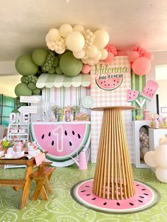 a watermelon themed birthday party with balloons