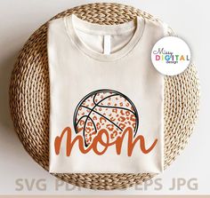 a t - shirt with the word mom written on it and a basketball ball inside